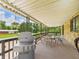 Covered patio area furnished with seating and a grill, offering a pleasant outdoor space at 2000 Hawthorne Dr, Plainfield, IN 46168