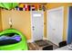 Finished basement includes an exterior door, closet and kayak at 206 Olive St, Arcadia, IN 46030