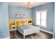 Nautical bedroom with lake decor, light and bright aesthetic, and modern lighting at 206 Olive St, Arcadia, IN 46030