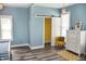 Bedroom features an ensuite bathroom with wood floors, ample natural light, and barn door at 206 Olive St, Arcadia, IN 46030