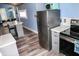 Charming kitchen features gray cabinets, stainless steel appliances, and a butcher block countertop at 206 Olive St, Arcadia, IN 46030
