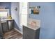 Charming kitchen nook with gray cabinets, stone countertops, and stainless steel dishwasher at 206 Olive St, Arcadia, IN 46030