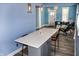 Bright kitchen island with seating and views into the living area at 206 Olive St, Arcadia, IN 46030