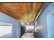 Bright kitchen with wood ceiling, quartz countertops, stainless appliances and window views at 206 Olive St, Arcadia, IN 46030