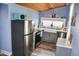 Well-appointed kitchen featuring stainless steel appliances, gray cabinets, and a farm sink at 206 Olive St, Arcadia, IN 46030
