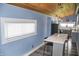 Bright kitchen featuring gray cabinets, an eat-in island, and stainless steel appliances at 206 Olive St, Arcadia, IN 46030
