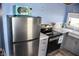 Modern kitchen equipped with stainless steel appliances, sleek counters, and ample storage at 206 Olive St, Arcadia, IN 46030