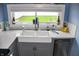Bright kitchen featuring a farmhouse sink with modern finishes and counter space at 206 Olive St, Arcadia, IN 46030