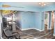 Open-concept view into a kitchen with bar seating and bedroom with closet at 206 Olive St, Arcadia, IN 46030