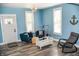 Inviting living room with ample light, comfortable furnishings and an open concept design at 206 Olive St, Arcadia, IN 46030