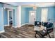 Bright living room showcasing modern décor, a cozy seating arrangement, and light hardwood floors at 206 Olive St, Arcadia, IN 46030