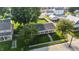 Aerial view of home's roof and porch nestled in a well-established neighborhood with mature trees at 212 N 13Th St, Elwood, IN 46036
