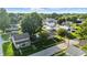 A picturesque aerial capture of a neighborhood surrounded by the lush green canopy of mature trees at 212 N 13Th St, Elwood, IN 46036