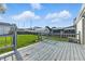 Enjoy outdoor living on this inviting back deck with views of the expansive, green backyard at 212 N 13Th St, Elwood, IN 46036