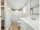 This bathroom has neutral paint, updated vanity, and tiled bathtub and shower at 212 N 13Th St, Elwood, IN 46036