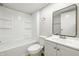 Bright, updated bathroom with a new vanity, modern fixtures, and combined tub and shower at 212 N 13Th St, Elwood, IN 46036