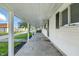 Inviting covered front porch with ample space and classic architectural details at 212 N 13Th St, Elwood, IN 46036