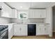 Bright kitchen featuring stylish white cabinets and a modern black dishwasher at 212 N 13Th St, Elwood, IN 46036