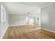 Spacious living area featuring hardwood floors, ample natural light, and an open layout at 212 N 13Th St, Elwood, IN 46036
