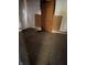Bedroom with original hardwood floors, boarded up doorway, and walls in need of repair at 2215 Noble St, Anderson, IN 46016