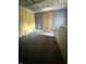 Bedroom under renovation with unfinished walls and bare concrete floor at 2215 Noble St, Anderson, IN 46016