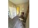 Living room undergoing renovations with exposed walls, and a vintage wooden chair at 2215 Noble St, Anderson, IN 46016