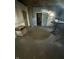 Living room with unfinished walls, bare concrete floors, and a vintage table at 2215 Noble St, Anderson, IN 46016