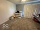 Bedroom with a crib, great natural light, and neutral decor creating a serene and adaptable space at 2230 Cedarmill Dr, Franklin, IN 46131