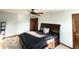A sunlit primary bedroom with a ceiling fan, offering ample space for relaxation and rest at 2230 Cedarmill Dr, Franklin, IN 46131