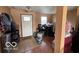 View of the entryway with tiled floors and an inviting door, though slightly cluttered at 2230 Cedarmill Dr, Franklin, IN 46131