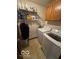 Laundry room with a washer, dryer, cabinets, and ample shelf space at 2230 Cedarmill Dr, Franklin, IN 46131