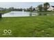 Green space and scenic water feature with fountain creating a peaceful environment at 2230 Cedarmill Dr, Franklin, IN 46131