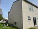 Side view of the house highlighting the siding and access to outdoor utilities at 2230 Cedarmill Dr, Franklin, IN 46131