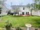 Expansive backyard featuring a lush lawn, patio furniture on a wooden deck, and a decorative bird bath at 2292 Hampton Dr, Franklin, IN 46131