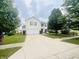 Well-kept home with a two-car garage, long driveway and a neatly landscaped front yard at 2292 Hampton Dr, Franklin, IN 46131