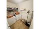 Efficient laundry room with washer, dryer, hanging racks and storage baskets for optimal organization at 2292 Hampton Dr, Franklin, IN 46131