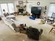 Large living room boasts comfortable furniture, a cozy stone fireplace, and ample natural light at 2292 Hampton Dr, Franklin, IN 46131