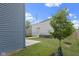 Spacious backyard features a detached garage, lush lawn, and concrete patio, perfect for outdoor enjoyment at 2326 Prospect St, Indianapolis, IN 46203