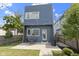 Backyard with patio, gas grill, patio set, string lights, and modern blue siding, complete with full lawn at 2326 Prospect St, Indianapolis, IN 46203