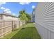 Green backyard with grass area and wooden fence, offering an inviting outdoor space at 2326 Prospect St, Indianapolis, IN 46203
