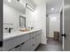 Luxurious bathroom featuring a dual sink vanity with marble countertops and a modern glass-enclosed shower at 2326 Prospect St, Indianapolis, IN 46203