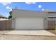 Two car detached garage with a concrete driveway and side lights offers parking and extra storage space at 2326 Prospect St, Indianapolis, IN 46203