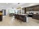 Modern kitchen with a large island, stainless steel appliances, and an open view to the living room at 2326 Prospect St, Indianapolis, IN 46203