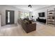 Stylish living room featuring a large gray sectional sofa, light wood flooring, and modern decor at 2326 Prospect St, Indianapolis, IN 46203