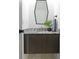 Elegant powder room with a granite countertop vanity, modern fixtures, and a sleek, geometric mirror at 2326 Prospect St, Indianapolis, IN 46203