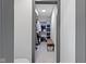 Organized walk-in closet features custom shelving, storage baskets, hanging rods, and a comfortable padded bench seat at 2326 Prospect St, Indianapolis, IN 46203