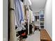 Custom walk-in closet featuring shelving, hanging racks, and bench with gray carpet, ideal for storage and organization at 2326 Prospect St, Indianapolis, IN 46203