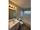Bathroom showing a vanity with a mirror and a shower and tub combination with modern fixtures at 2354 Collier St, Indianapolis, IN 46241