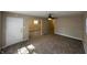 Inviting living room features neutral walls, ceiling fan, and plush carpeting at 2354 Collier St, Indianapolis, IN 46241