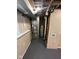 View of the basement mechanicals, including HVAC and water heater, painted walls, and new flooring at 2626 Fairhaven Dr, Indianapolis, IN 46229